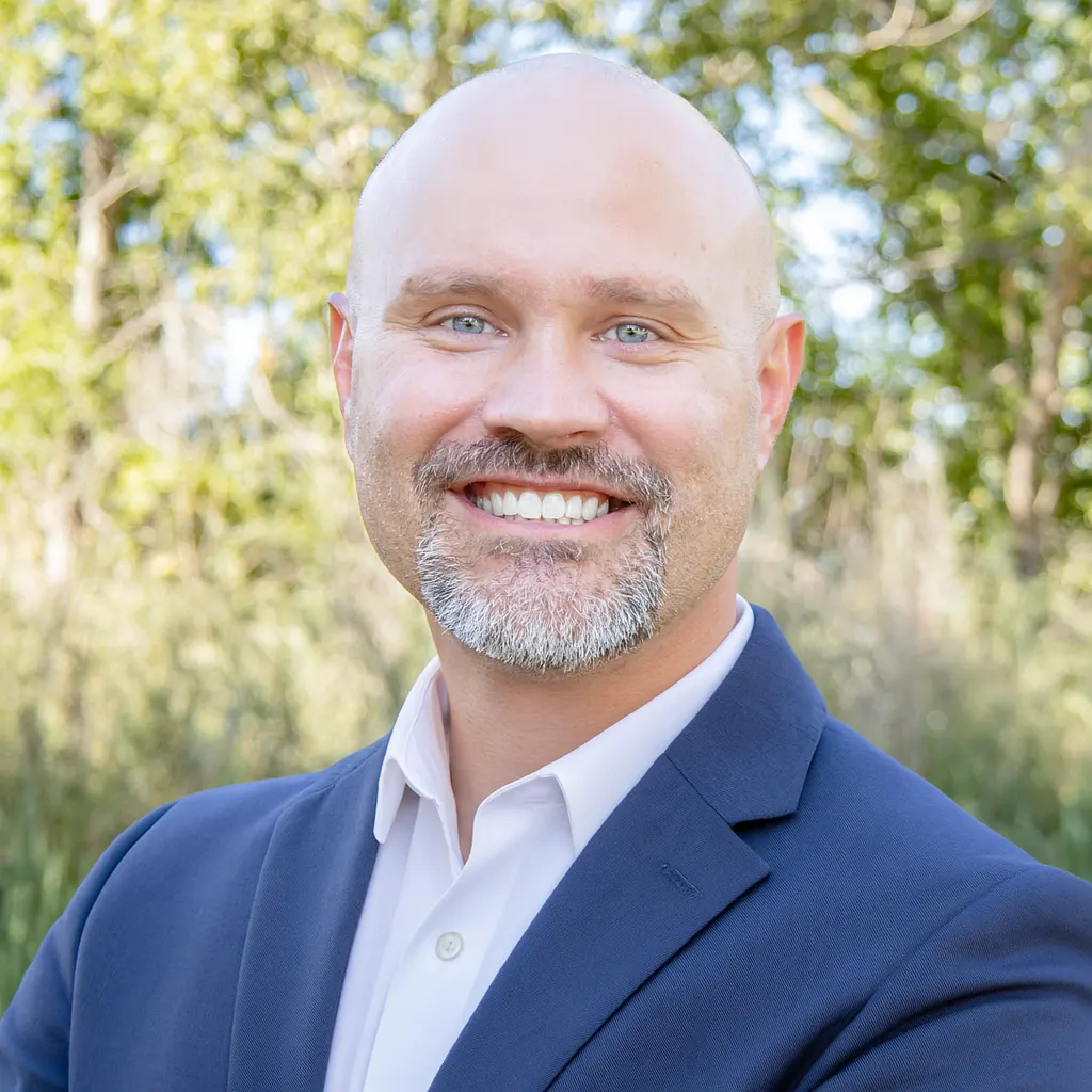 John Seal, CEO of Kardia Marketing, photographed outdoors in a navy blazer